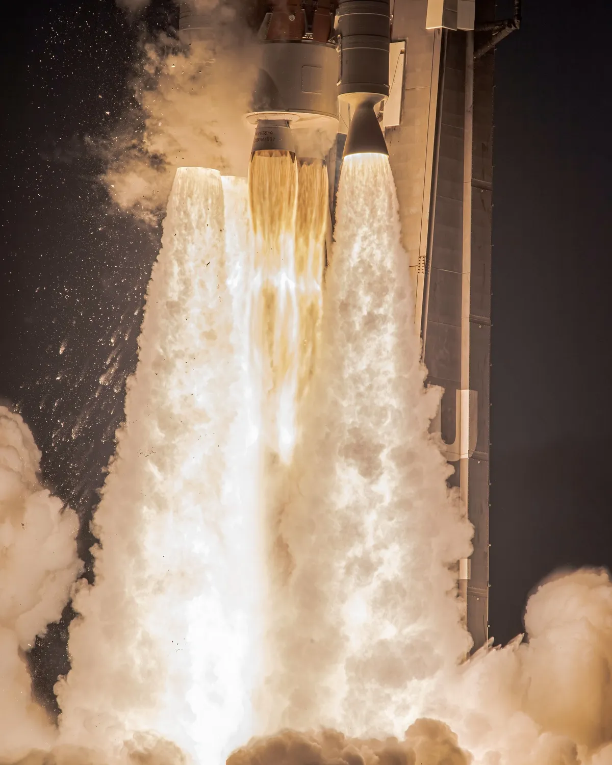 Close view of an Atlas V rocket’s engines igniting at liftoff